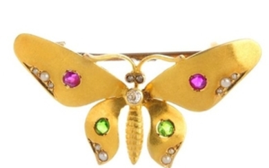 An Edwardian gold diamond and gem-set butterfly brooch.
