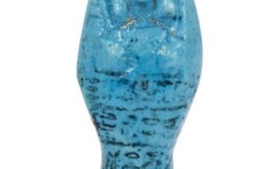 An Egyptian white-glazed composition shabti, 19th-20th Dynasty,...