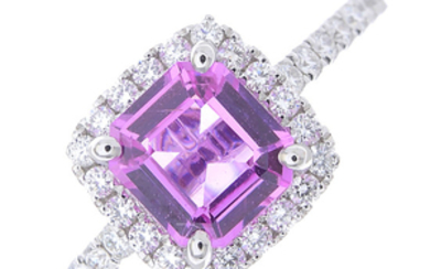 A pink sapphire and diamond cluster ring.
