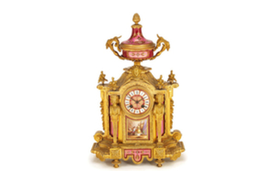 A late 19th century French gilt bronze mounted Sevres style pink and claret porcelain mantel clock