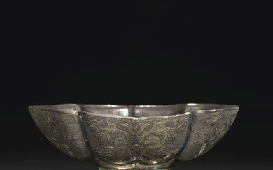A FINE SMALL PARCEL-GILT SILVER QUATREFOIL CUP, TANG DYNASTY (AD 618-907)