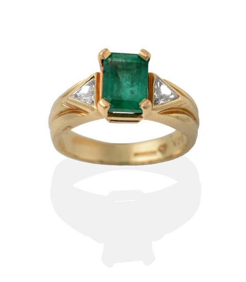 A 14 Carat Gold Emerald and Diamond Ring, the step-cut...
