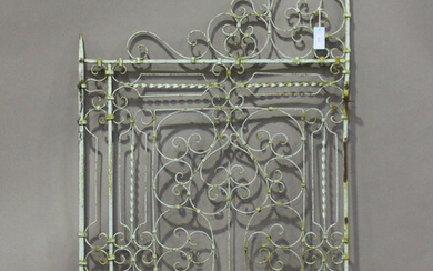 A 19th century green painted wrought iron single gate of scrollwork form, height 170cm, width 87cm.