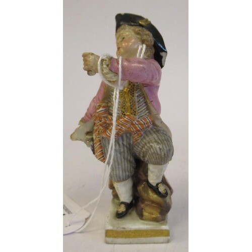 A 19th/20thC Meissen porcelain figure, a boy dressed as a pi...