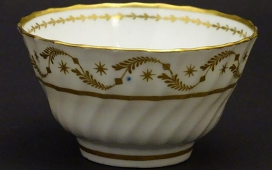 A 19thC white porcelain tea bowl with ribbed sides and
