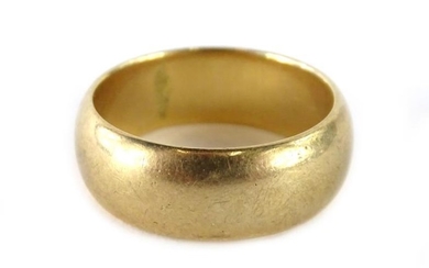 A 9ct gold wedding band, of plain design, with...
