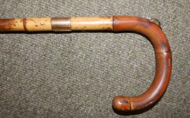 A Brigg walking stick with 12ct gold mounts initialled...