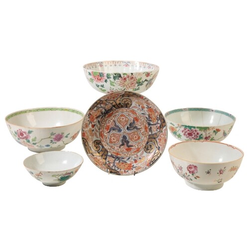 A CHINESE FAMILLE ROSE PUNCH BOWL with a ribbed body decorat...