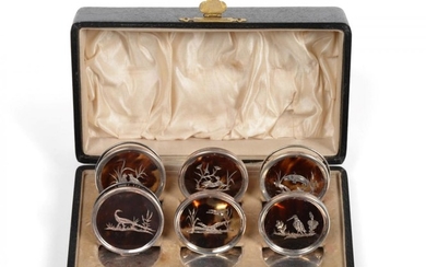 A Cased Set of Six George V Silver-Mounted Tortoiseshell Place-Card...