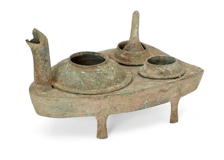 A Chinese bronze zoomorphic stove, Han dynasty, modelled as a...