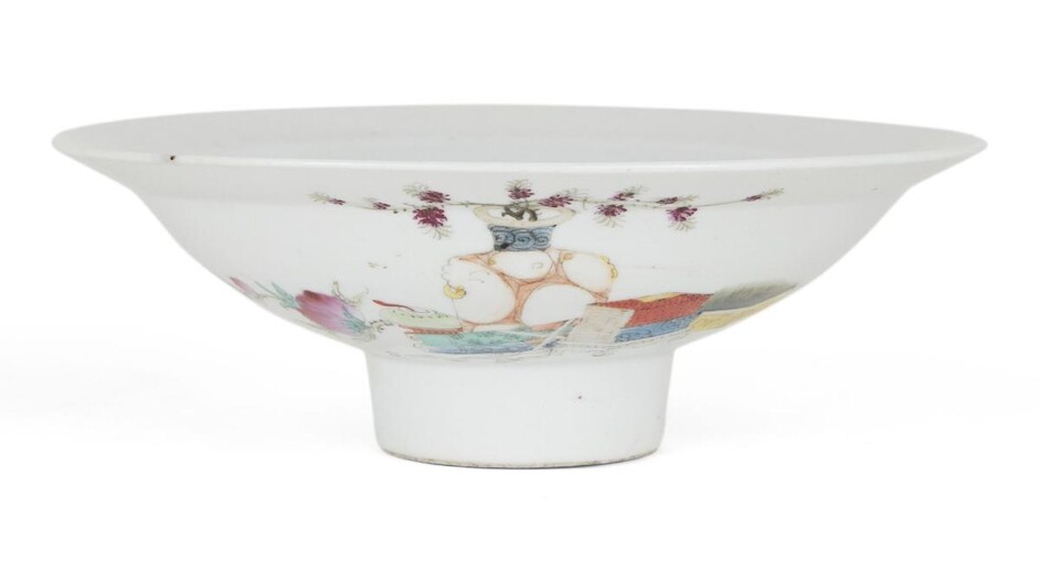 A Chinese porcelain famille rose footed bowl, Republic period, painted with a large vase bearing flowering branches amongst scholars objects and peaches, 20.2cm diameter