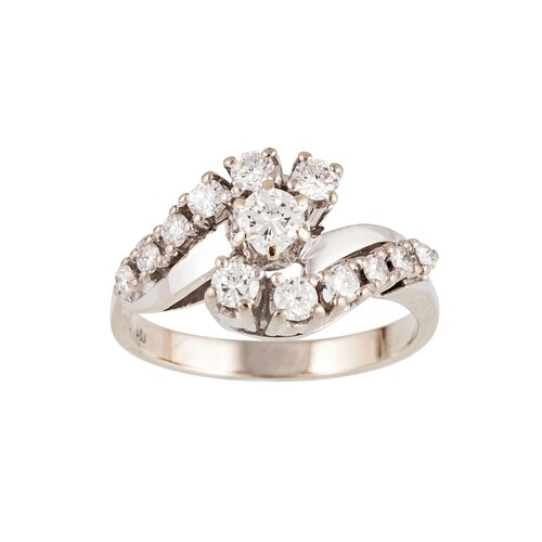 A DIAMOND CLUSTER RING, of twist design, the diamonds mounte...
