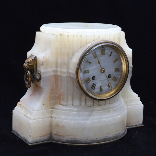 A FRENCH ONYX CASED CLOCK PEDESTAL.