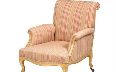 A GILTWOOD AND UPHOLSTERED ARMCHAIR IN LOUIS XV STYLE