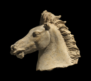 A GREEK TERRACOTTA HORSE HEAD, TARENTINE, CLASSICAL PERIOD, CIRCA 4TH CENTURY B.C.