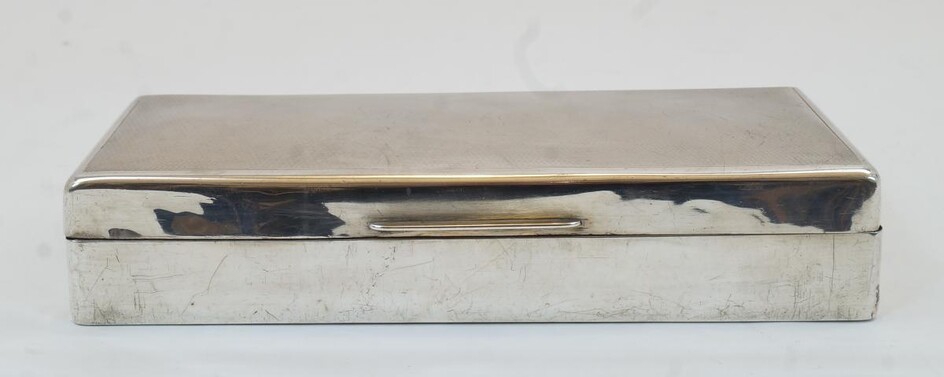 A George VI silver cigarette box, London, 1943, S J Rose & Son, of rectangular form with engine turned cover and wood lined interior, 20.5cm wide, 9cm deep