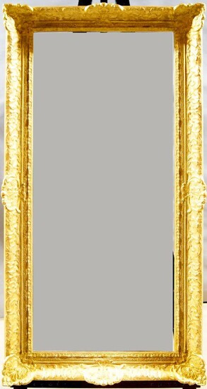 A Gilded Composition Louis XIV Style Frame, mid-late 20th century, with cavetto sight, leaf course, sanded frieze, the cross-hatched ogee with foliate and flower head scrollwork and shell cartouche centres and corners, 44.5 x 108.5 cm: A Gilded...