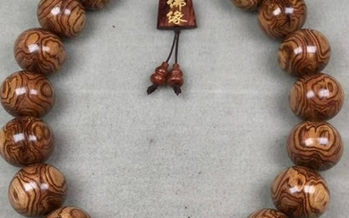 A HUANGHUALI WOOD STRING BRACELET WITH 20 BEADS
