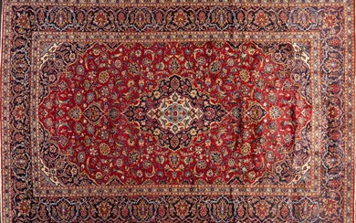 A Kashan hand knotted wool rug, 8’1” x 12’4”