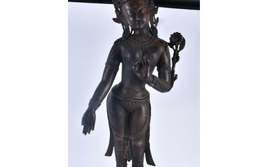 A LARGE 19TH CENTURY INDIAN TIBETAN BRONZE FIGURE OF A STAND...