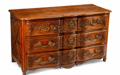 A Louis XV Provincial Carved Walnut Commode
