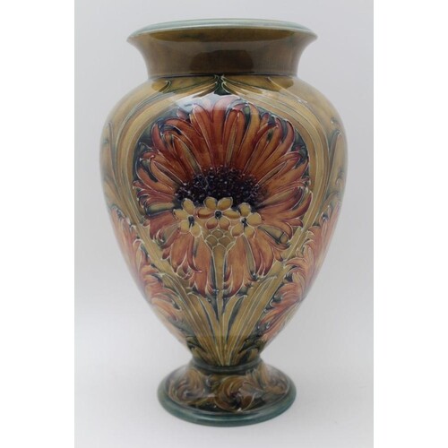 A MOORCROFT POTTERY VASE OF BALUSTER FORM, tube lined and pa...