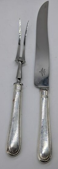 A Mappin & Webb silver handled carving knife, L.36.5cm