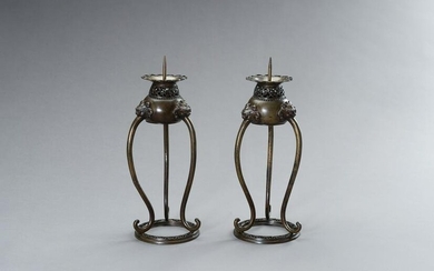 A PAIR OF BRONZE CANDLE STICK HOLDERS