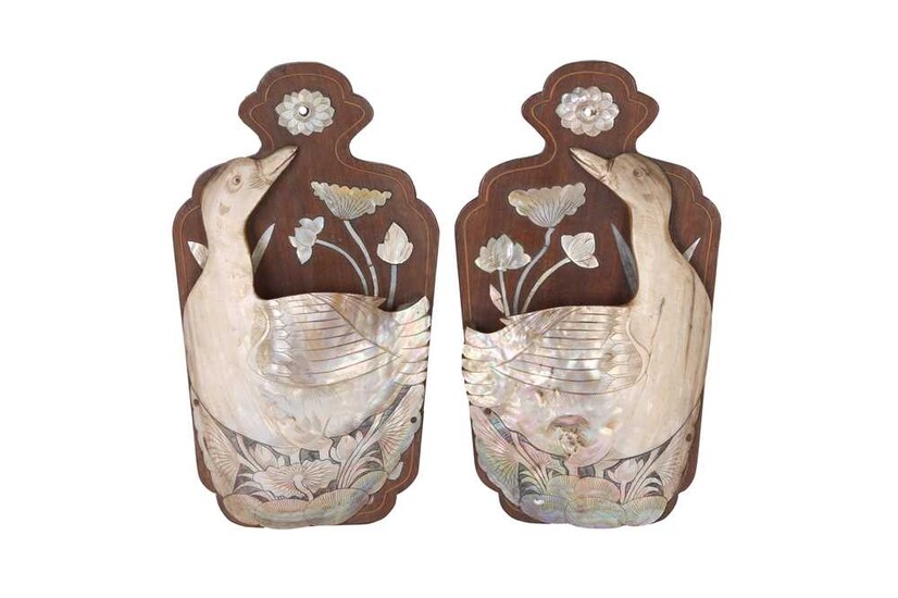 A PAIR OF EARLY 20TH CENTURY INDO-CHINESE CARVED MOTHER OF PEARL WALL MOUNTS DEPICTING SWANS