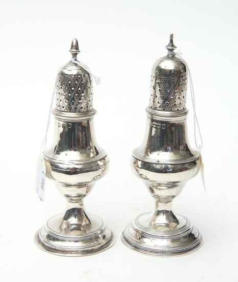 A PAIR OF GEORGE III STERLING SILVER PEPPERETTES, MAKER'S MARK RUBBED, LONDON, 1790, EACH WITH A PIERCED AND LATTICE ENGRAVED COVER...