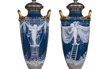 A PAIR OF MINTONS PATE-SUR-PATE PEACOCK BLUE VASES AND COVERS...