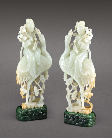 A PAIR OF WHITE JADE FIGURES OF MAGU AND SPINACH-GREEN JADE STANDS 19TH – 20TH CENTURY