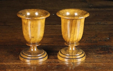 A Pair of 19th Century Turned Olive-wood Goblets. The deep bowls with flared rims above short blade