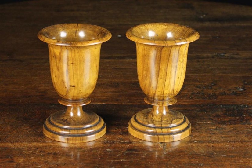 A Pair of 19th Century Turned Olive-wood Goblets. The deep bowls with flared rims above short blade