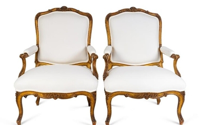A Pair of Louis XV Giltwood Bergeres Height 42 x width