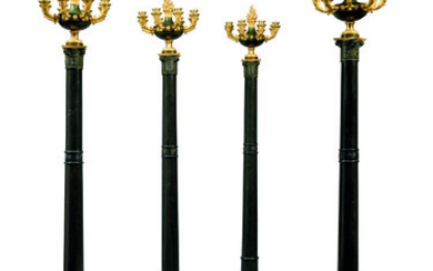 A SET OF FOUR EMPIRE ORMOLU, PATINATED-BRONZE AND BRONZED SIX-LIGHT TORCHERES
