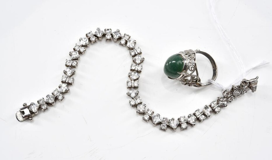 A STONE SET LINE BRACELET IN STERLING SILVER, TOGETHER WITH A QUARTZ RING IN SILVER