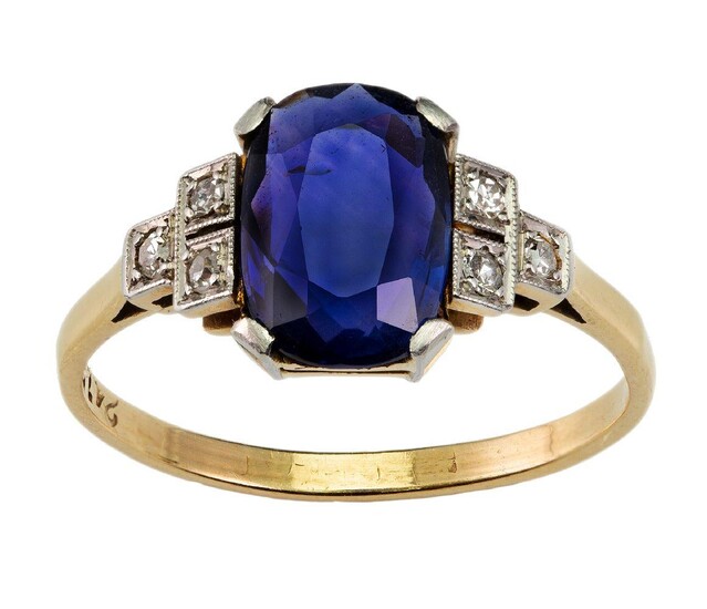 A Sapphire and diamond ring, claw set with an oval sapphire weighing approximately 2.50 carats set between single-cut diamond shoulders, ring size P. Accompanied by a copy report number 79197 - 06 , dated 23 January 2019, from the GCS, London...