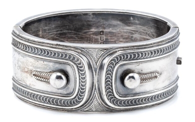 A VICTORIAN STERLING SILVER HINGED CUFF BANGLE; 3cm wide with applied cuff and link design, hallmarked Birmingham 1882, internal cir...