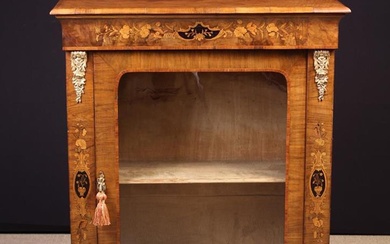 A Victorian Inlaid Figured Walnut Pier Cabinet. The rectangular top with moulded edge above an inlai