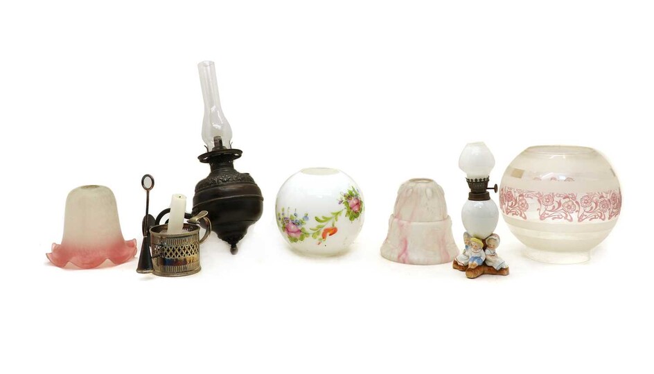 A box of oil lamps and glass shades