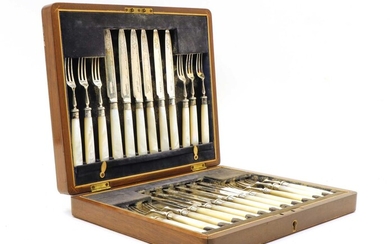 A cased set of twelve silver and mother of pearl handled fruit knives and forks