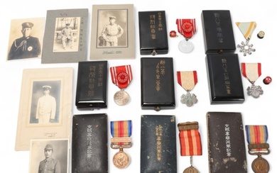 A collection of Japanese medals, in original cases, together...