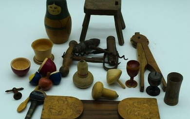 A collection of antique cork screws together with treen