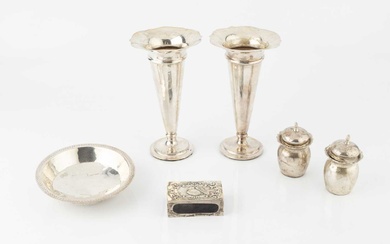 A collection of silver, comprising eight American saucers, stamped sterling,...
