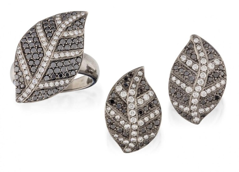 A diamond and black diamond ring and pair of earrings, of matching pavé brilliant-cut black diamond leaf design with brilliant-cut diamond veins, one diamond deficient, in blackened mounts, earrings with post fittings, ring size T½, length of...