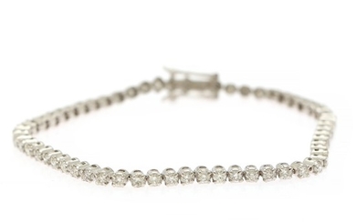 A diamond bracelet set with numerous brilliant-cut diamonds, totalling app. 2.95 ct., mounted in 14k white gold. W. 3 mm. L. 18.5 cm.