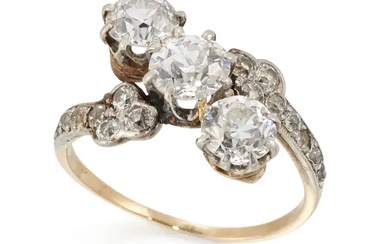 A diamond three stone crossover ring, the three old brilliant cut diamonds,...