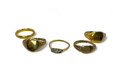 A group of five gold rings. Comprising: A 22ct band...