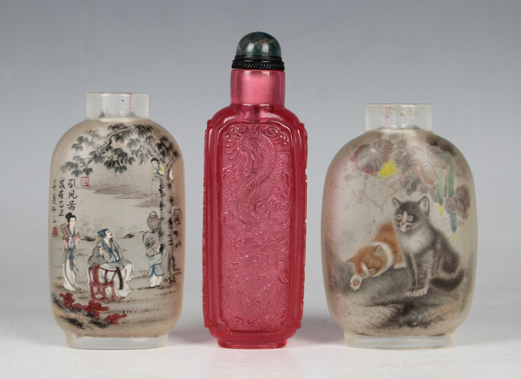 A group of three Chinese glass snuff bottles, 20th century or later, comprising two with inside pain